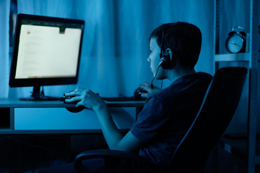 Young boy playing on computer